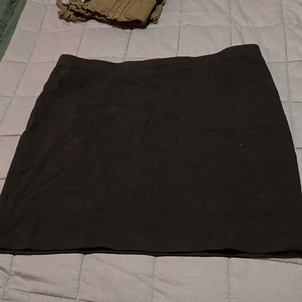 Black body on mini skirt